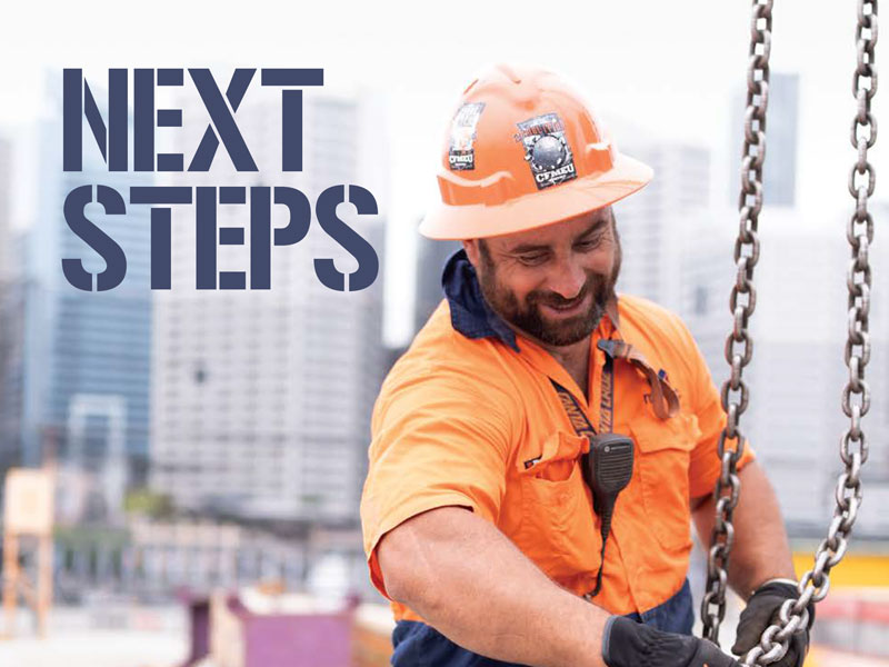 Construction worker in an orange shirt and hard hat at a construction site, with a large 'NEXT STEPS' overlay on the left.